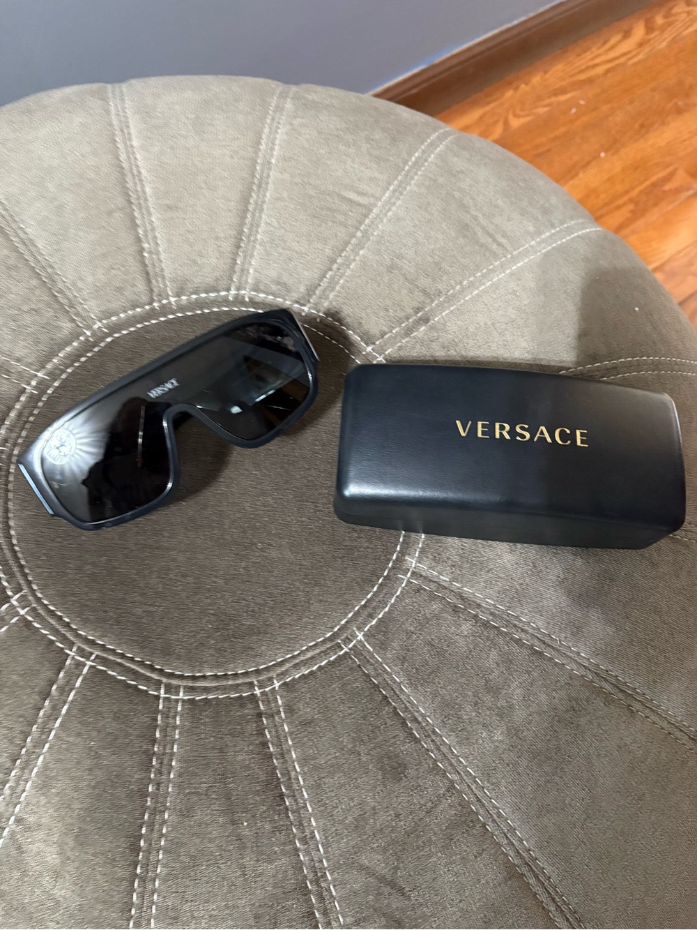 Sunglasses arm with Versace label